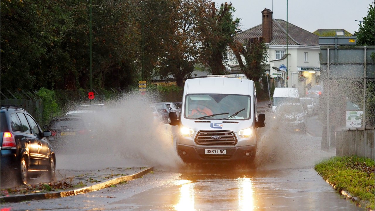 Flood warning and road closures as heavy rain hits the UK