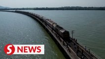 Thailand's 'floating train' a hit as dam waters rise