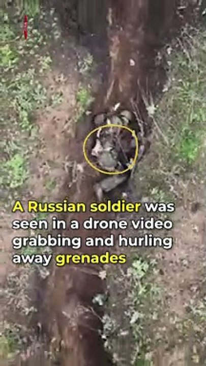 Russian Soldier Casually Hurls Grenade dropped From Ukranian Drone