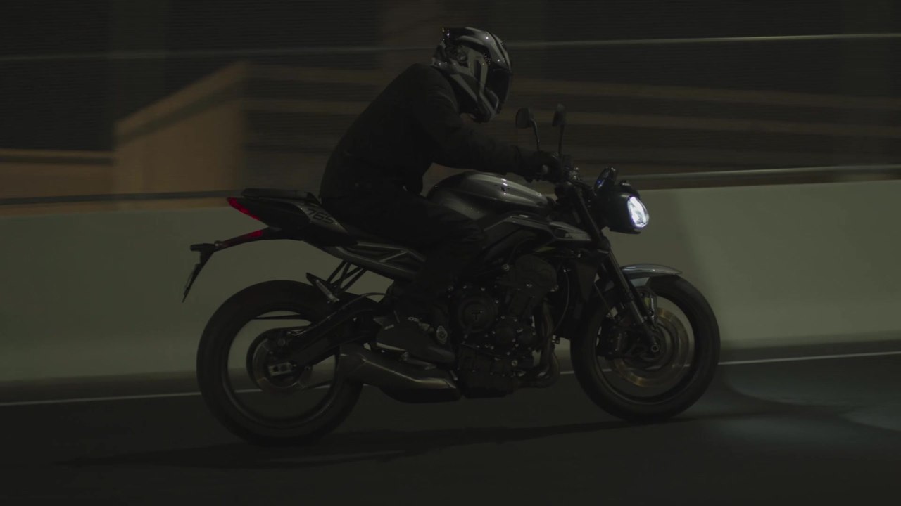 The new Triumph Street Triple R Driving in the city