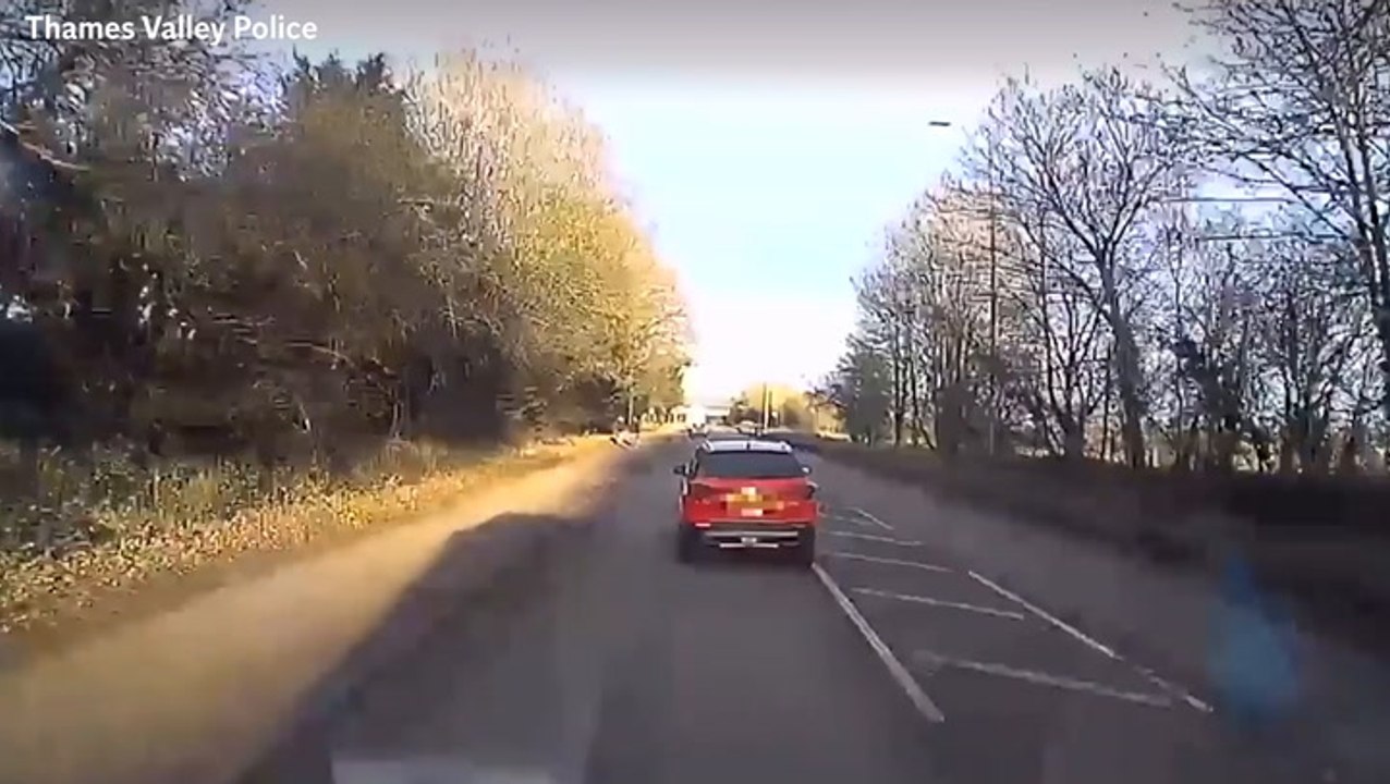 Driver deliberately brakes and swerves in front of ambulance on emergency call