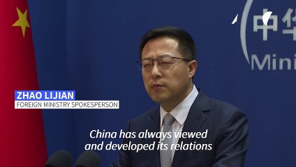 China says US should help get relations on 'right track'