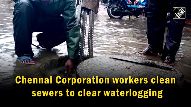 Chennai Corporation workers clean sewers to clear waterlogging