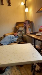 Cat and Dad Hold Hand and Paw While Watching TV