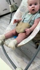 Cat Appears to Swing Baby in Rocker