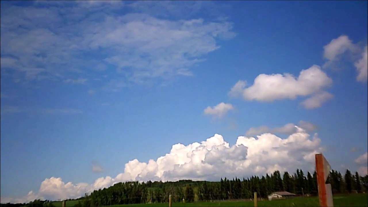 MCH 353 THESE CLOUDS HAVE A THREE D EFFECT WATCH AND SEE IF YOU CAN SPOT IT.