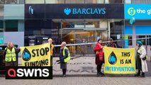 Climate activists smear Barclays windows with black paint in protest at bank's funding of fossil fuel industries