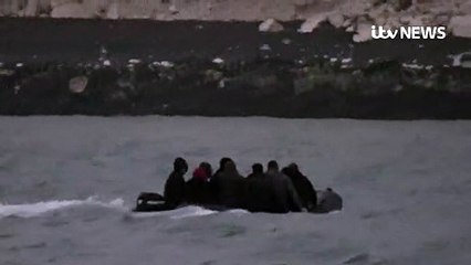Small boat full of migrants lands on beach in Dover