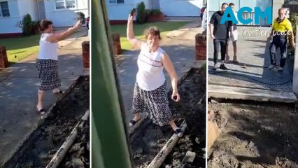 Elderly woman slings mud at tradies as wild neighbour dispute erupts