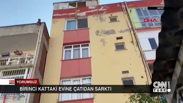 İçeride anahtarını unuttuğu dairesine çatıdan halatla sarktı, asılı kaldı