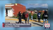 Con cohetones y piedras, normalistas se enfrentan a policías en Michoacán