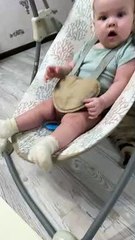 Cat Appears to Swing Baby in Rocker