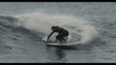 Surfer Brilliantly Balances Himself Over Tricky Wave in Ocean
