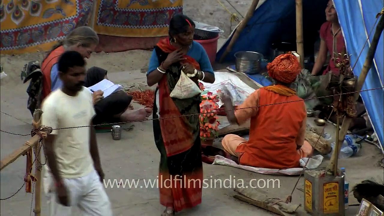 Sadhu Baba having tea with foreigner friend