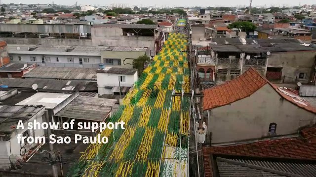 Brazilians turn Sao Paulo streets yellow and green ahead of World Cup