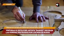 Pinturas al estilo del artista Banksy decoran las paredes destruidas por los misiles rusos