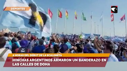 Скачать видео: Hinchas argentinos armaron un banderazo en las calles de Doha