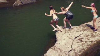 Adventure Boys and Girls Swimming And Jumping Into Deep Water Of River At Countryside