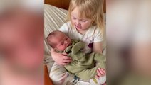 Cute moment four-year-old tells newborn brother she will teach him how to eat snow