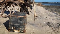 Florida man finds trunk from the 1930s washed up on beach
