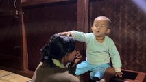 Child Imitates the Priest Praying