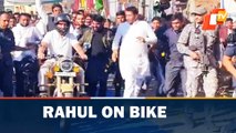 Congress MP Rahul Gandhi rides motorbike during 'Bharat Jodo Yatra' in Madhya Pradesh