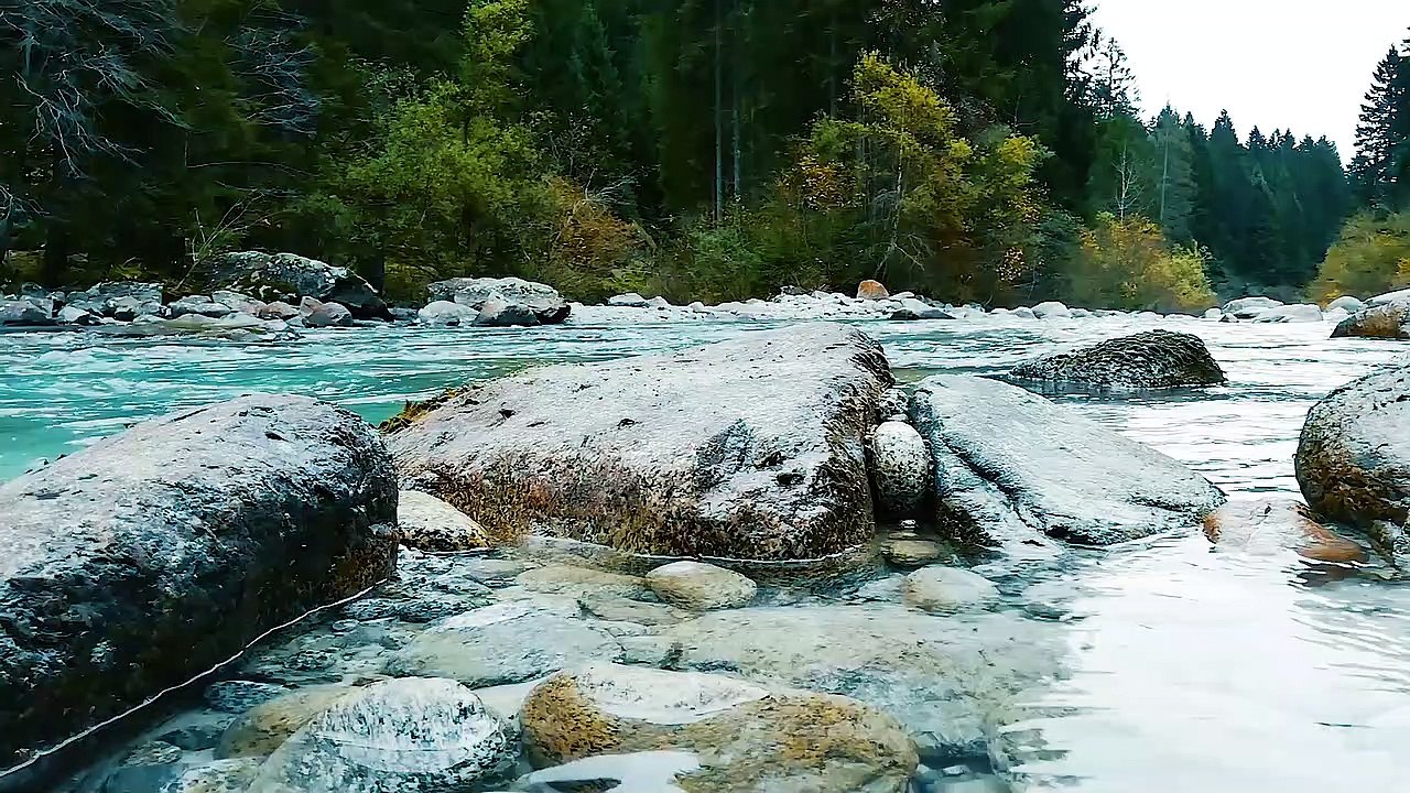 Boulders Of Rocks Formation On The Riverside Of A River In The Forest