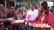 Shilpa Shetty gives a pizza treat to paparazzi