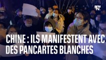 Ces manifestants chinois brandissent des pancartes blanches pour dénoncer les restrictions sanitaires