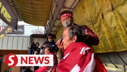 South Korean truckers shave heads in protest as government orders drivers back to work