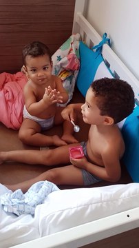 Boy Caught Giving Yogurt to His Little Brother