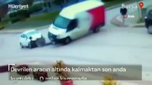 Bursa'da bir kişi devrilen aracın altında kalmaktan son anda kurtuldu... O anlar kamerada
