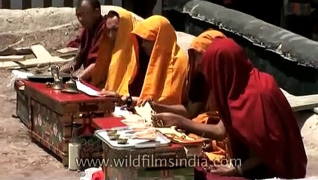 Monks chanting prayers during a Buddhist religious ceremony in Leh