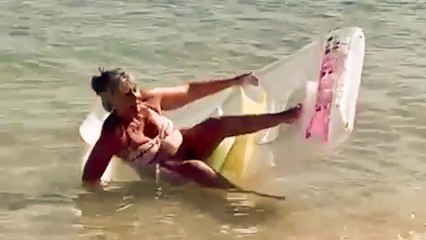 Woman eats her words after claiming she knew the correct way to get on a lilo