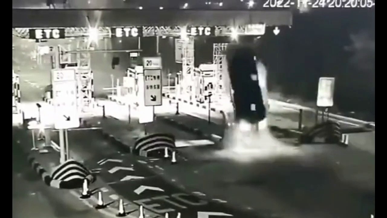 Shocking moment car slams into a motorway toll station sending vehicle flying 50ft into the air with the driver somehow surviving crash in China