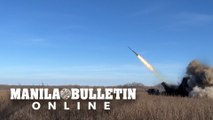 Ukrainian soldiers fire Bureviy multiple rocket launcher