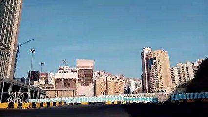 Pigeon under the clock tower at the site of the Kaaba.