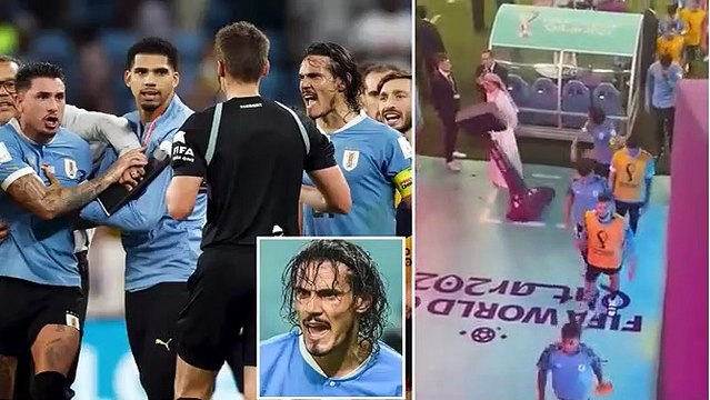 Edinson Cavani PUNCHES pitch-side VAR monitor after Uruguay players chase officials down the tunnel as frustration boils over in on-pitch melee following World Cup exit despite 2-0 win over Ghana