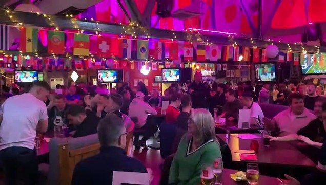 Fans sing three lions at The Common Room in Sheffield as England beat Senegal.