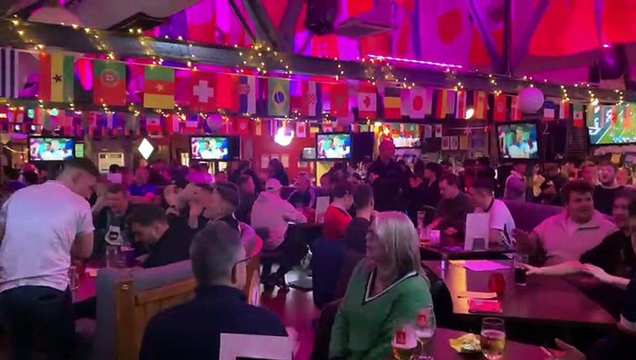 Fans sing three lions at The Common Room in Sheffield as England beat Senegal.