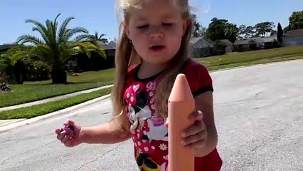 Diana and Roma draw with giant crayons