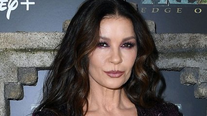 The Neckline of Catherine Zeta-Jones’s Sheer Cut-Out Jumpsuit Nearly Plunged to Her Belly Button