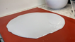 Woman makes her 7th try to separate hot isomalt from a mat; it combusts a marble counter!