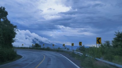 the curvy road passes through the beautiful and nice mountains