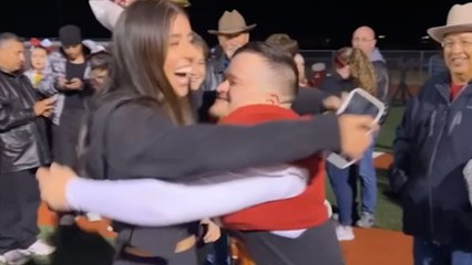 Sister Surprises Brother Who Has Down Syndrome During Senior Night Football Game | Happily TV
