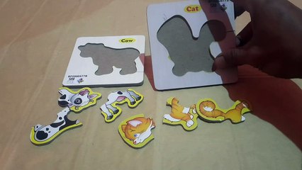 Merakit puzzle jigsaw, gambar kucing dan gambar sapi