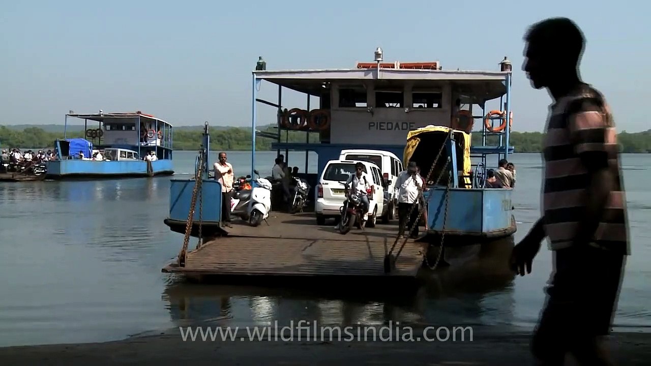 Taking Bikes and cars on Ferries across Mapusa River at Penha de France, Goa