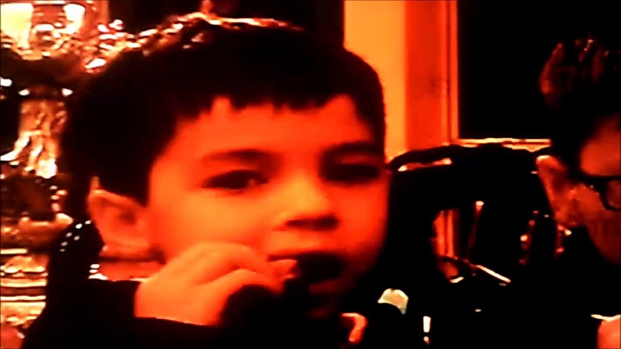 Jonathan playing his DS while Christopher & Anthony are being giants