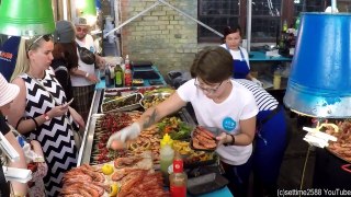 Huge Pans Cooking Huge Doses of Fish.  Kiev Street Food, Ukraine 4K HD