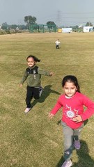 Akshu, Duggu & Trishu facing on cricket ground